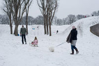 Family walking outside in the snow