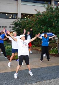 People on the street exercising.