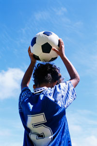 Child playing soccer