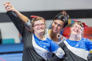 Two Teen Girls Practice Cheerleading