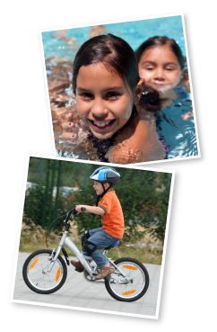 Two girls swimming in pool, boy on bicycle wearing helmet