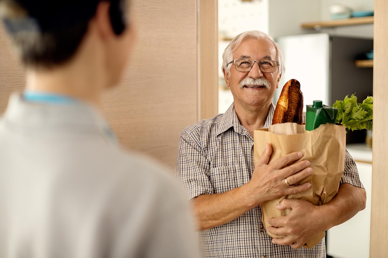 man with groceries
