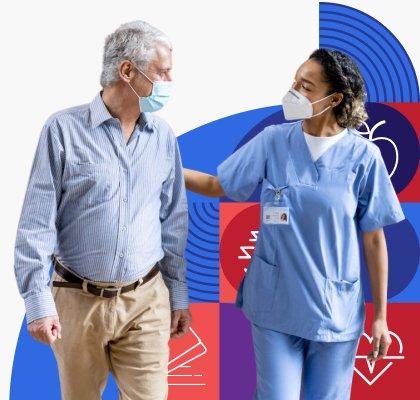 A medical professional is wearing a face mask and putting their hand on the back of a patient who is also wearing a face mask. 