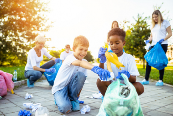 Children participating in a park cleanup