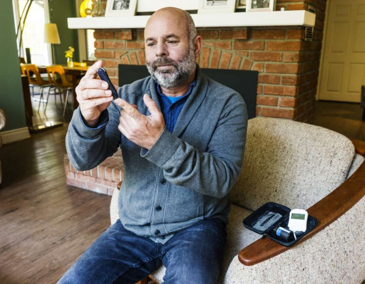 Man testing his blood sugar.