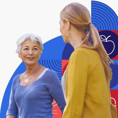 An older woman talks to younger woman.