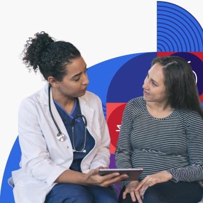 A pregnant woman talks to a health care provider.
