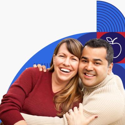 Man and woman hugging and smiling.