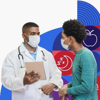Un doctor de raza negra habla con un paciente joven.