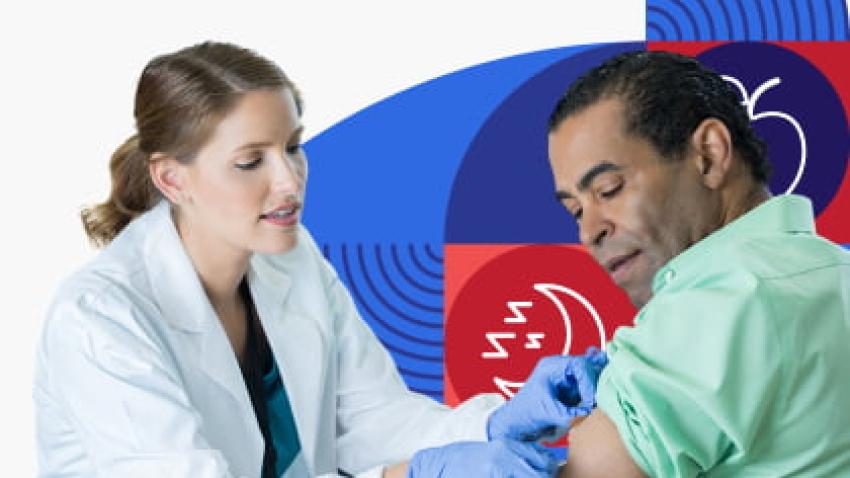 A man gets a vaccine from a health care provider.