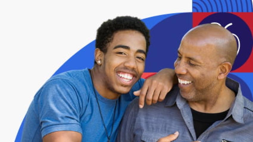 Father and teen son laughing together.