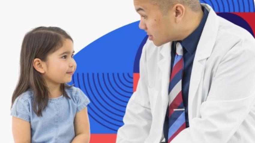 Health care provider talking with young girl
