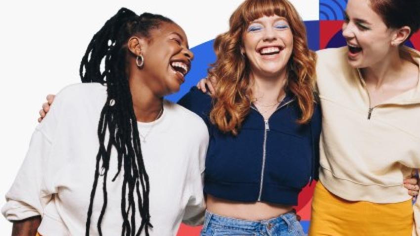 Three women laughing.