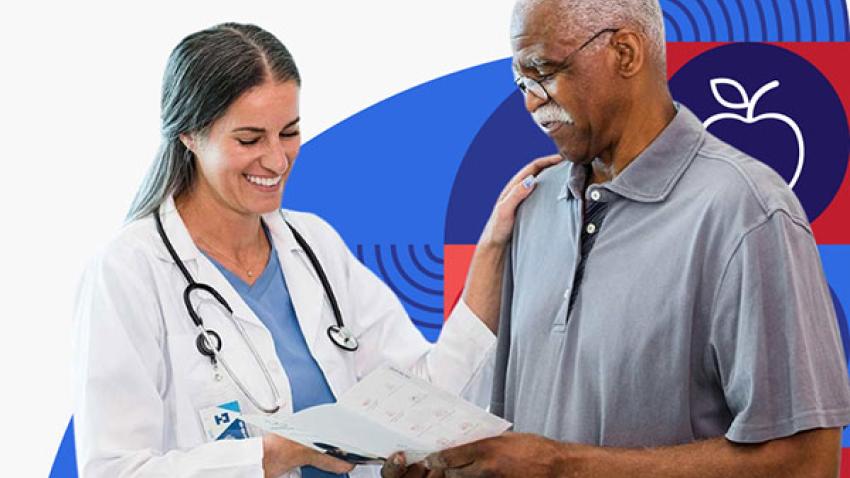 A female doctor with long dark hair wearing a white lab coat reviews paperwork with her older male patient.